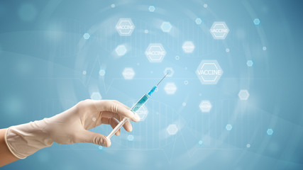 Female doctor holding syringe