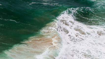 Ocean storm with with big windy waves. Background shot of clear sea water surface