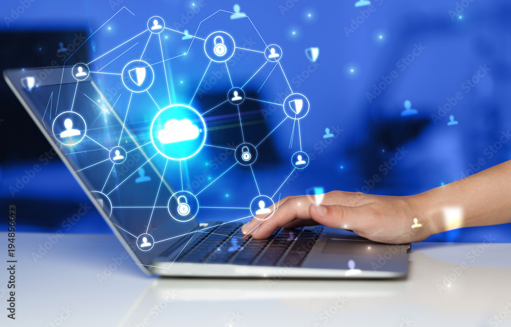 Aufkleber Hand using laptop with centralized linked cloud system concept