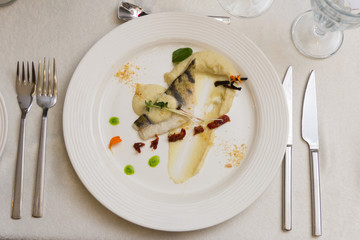 Fillet of pikeperch with botany on a pillow of original mashed potatoes made from celery and baked apples
