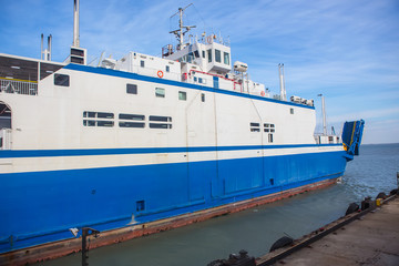 Naklejka premium Modern ferry on the dock. Side view.