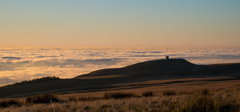 Rivington Pike stands above clouds 