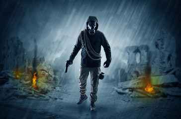 After catastrophe men coming in gas mask and arms