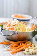 Vietnamese carrot salad on rustic wooden table. Traditional Vietnamese cuisine.