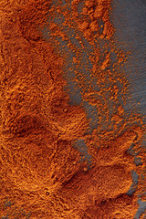 Texture background. Red chilli pepper powder. Top view