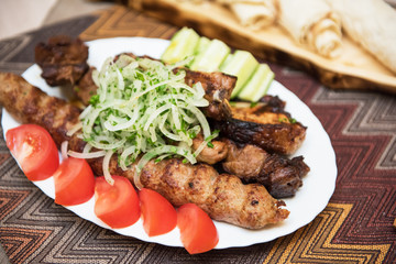 Grilled shish kebab or shashlik meat with vegetables
