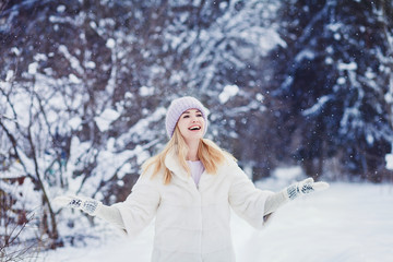 Winter smiling woman in fur coat 