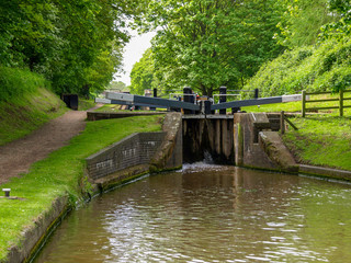 Fototapeta premium Bottom gate of a canal lock on the Shropshire Union Canal near Audlem in Cheshire, England.