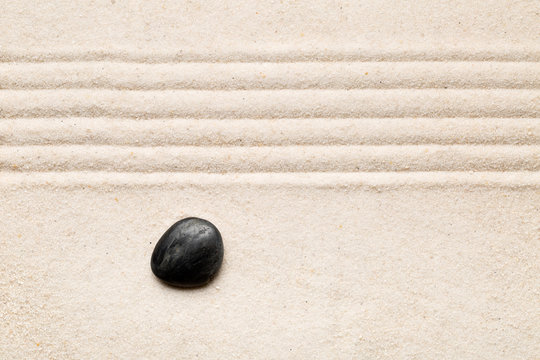 Zen sand and stone garden with raked lines. Simplicity, concentration or calmness abstract concept