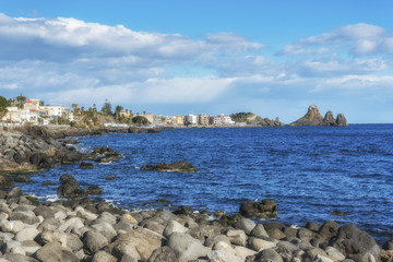 Volcanic stone coast of Aci Castello. Sicily. Italy.