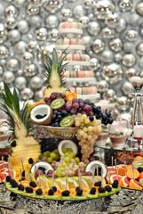 Vegetables and fruits are well-cut on a buffet