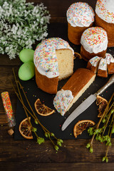 Easter cake and colorful eggs on a wooden table. It can be used as a background