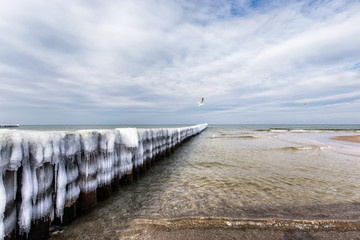 Fototapeta premium Ice covered groynes