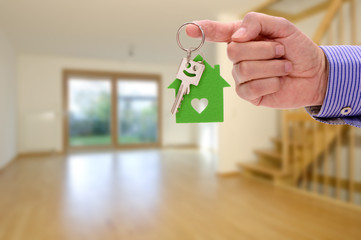 key for your new home in hand of real estate agent
