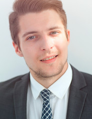 closeup.the face of a successful young man