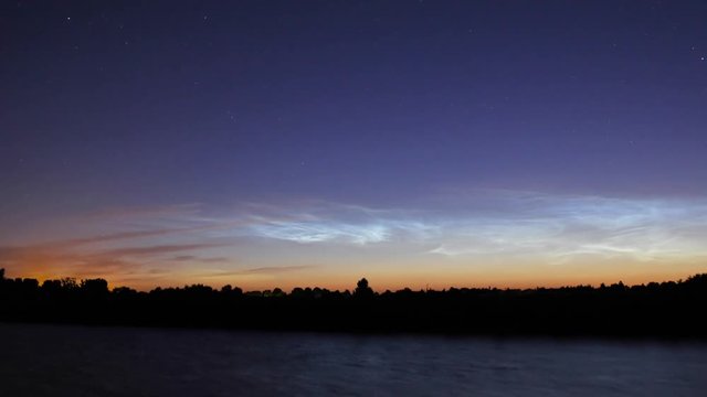 noctilucent clouds NLC over Noordhollandsch Kanaal canal summer midnight twilight timelapse
