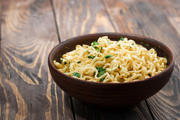 bowl of traditional Chinese noodles on wooden background