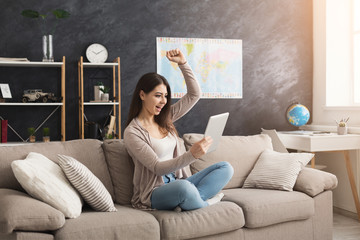 Young woman at home with tablet