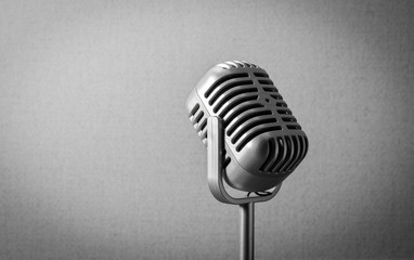 vintage silver retro microphone on grey background