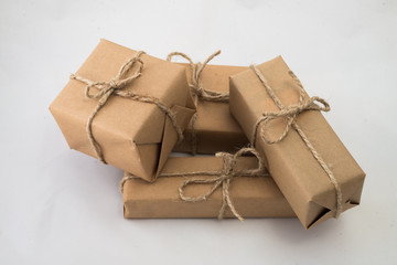 Stack of handcraft gift boxes on white background