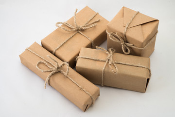 Stack of handcraft gift boxes on white background