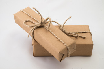 Stack of handcraft gift boxes on white background