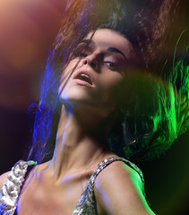 Beautiful young woman dancing in the nightclub
