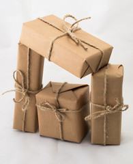 Stack of handcraft gift boxes on white background