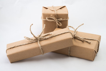 Stack of handcraft gift boxes on white background