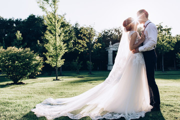 Walking newlyweds in nature.