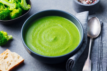 Broccoli cream soup in a bowl with toasted bread.