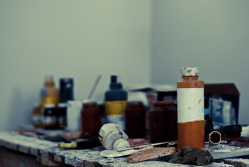 Workplace with jars of paint