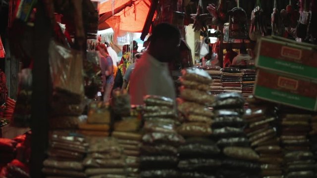 Locals buy supplies at the Zanzibar spice market.