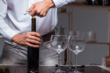 Professional sommelier tasting wine in restaurant