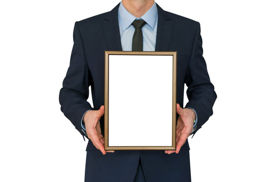 Mockup. Business man holding in hands empty blank photo frame.