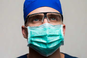 young surgeon on white background
