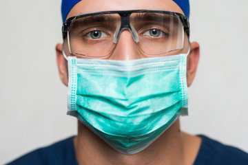 young surgeon on white background