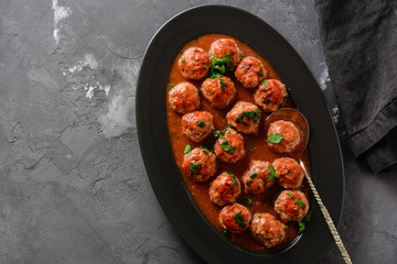 Meatballs in sweet and sour tomato sauce. Top view