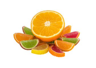Fruit jell sugar candies and orange isolated on white background.