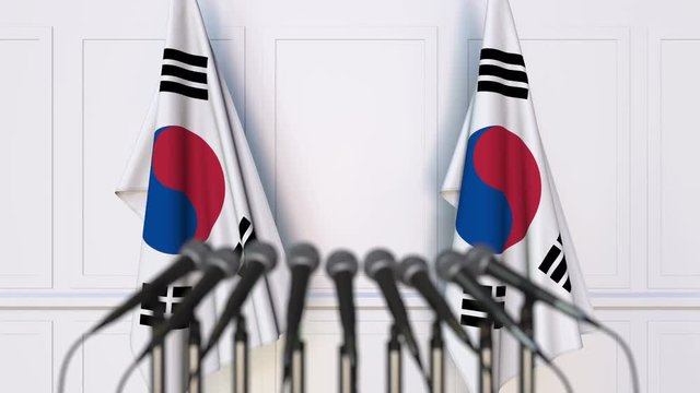 Korean official press conference. Flags of South Korea and microphones. Conceptual animation