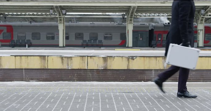 Male going on railway platform