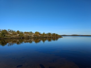 lake in the tundra among Karelian birches