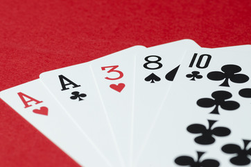The combination of playing cards in poker on a red background