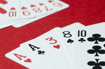 The combination of cards in poker on a red background