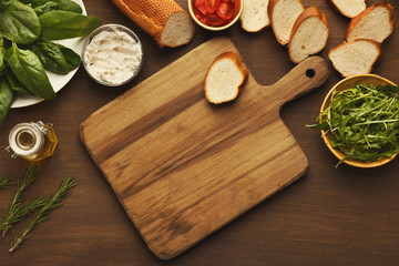 Obraz na płótnie Canvas Making healthy bruschettas with organic ingredients