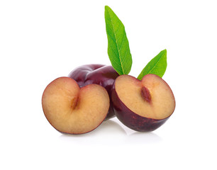 red cherry plum with green leaves isolated on white background