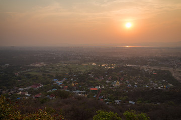 Beautiful sunset in Mandalay, Myanmar (Burma), viewed from above from the Mandalay Hill.