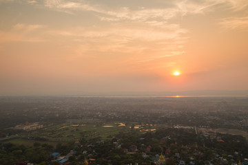 Beautiful sunset in Mandalay, Myanmar (Burma), viewed from above from the Mandalay Hill. Copy space.