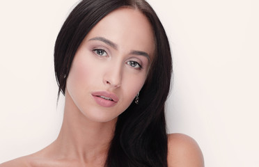 Fototapeta premium Beautiful girl close up face portrait with long hair style.