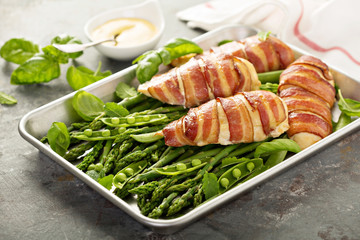 Bacon wrapped chicken breast with asparagus